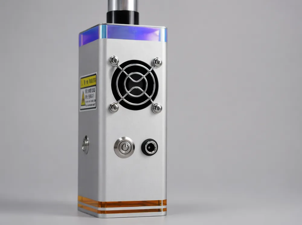 KyberSpark Core V2 control face showing the power-symbol button, unlabeled socket, and side controls