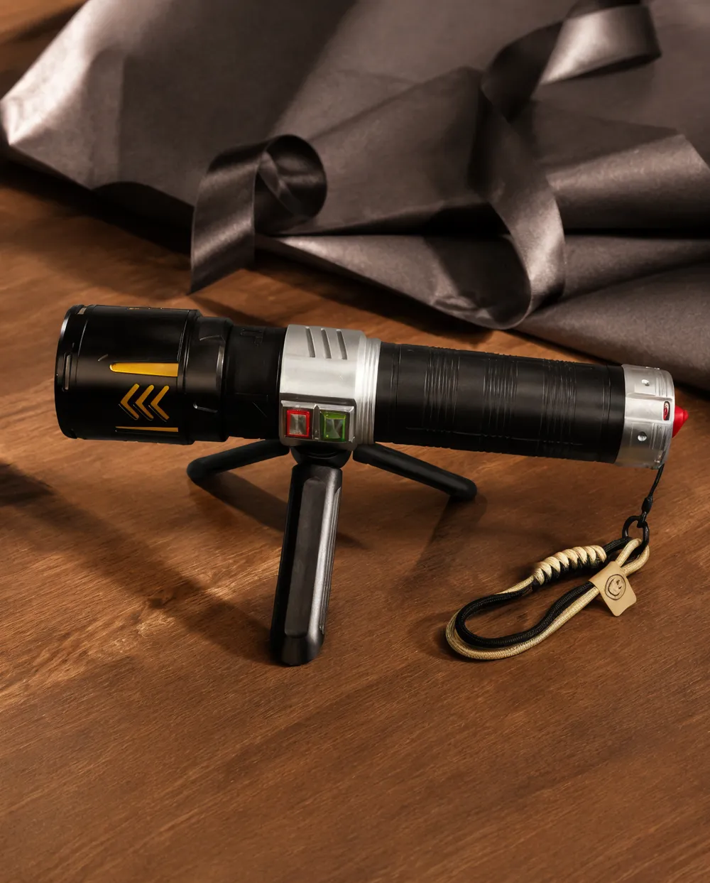 KyberSpark X propped on its fold-out bracket on a wooden surface in a gift arrangement