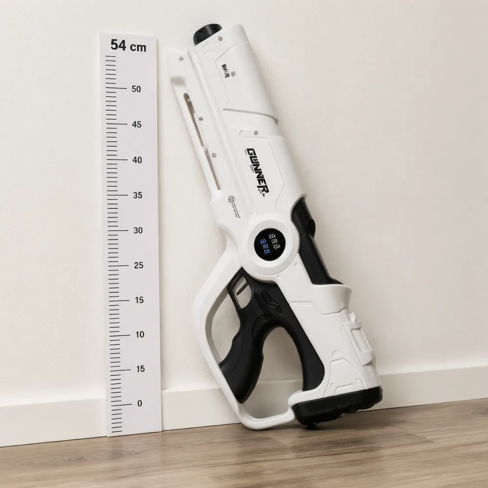 Beam Cannon MK-V leaned upright against a white wall with a person standing beside it for height comparison, showing the full 54 cm profile and physical presence